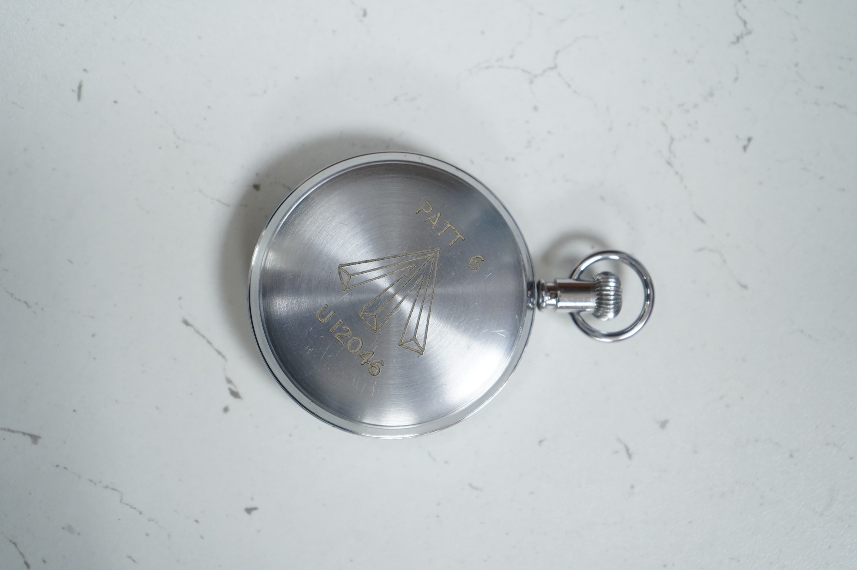 An Asdic military stopwatch by Waltham, U.S.A., Admiralty Pattern No.6, engraved to the reverse with broad arrow and; ‘Patt. 6, U12046’, retains inner dust cover